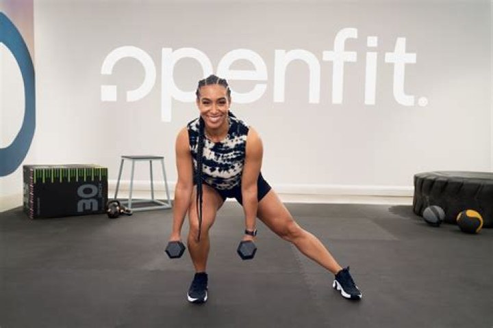 Celebrity Trainer Lita Lewis in Workout Clothes Lifts Weights in Her Yard