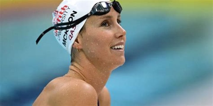 Emma McKeon in Workout Gear is a "Dog Person"